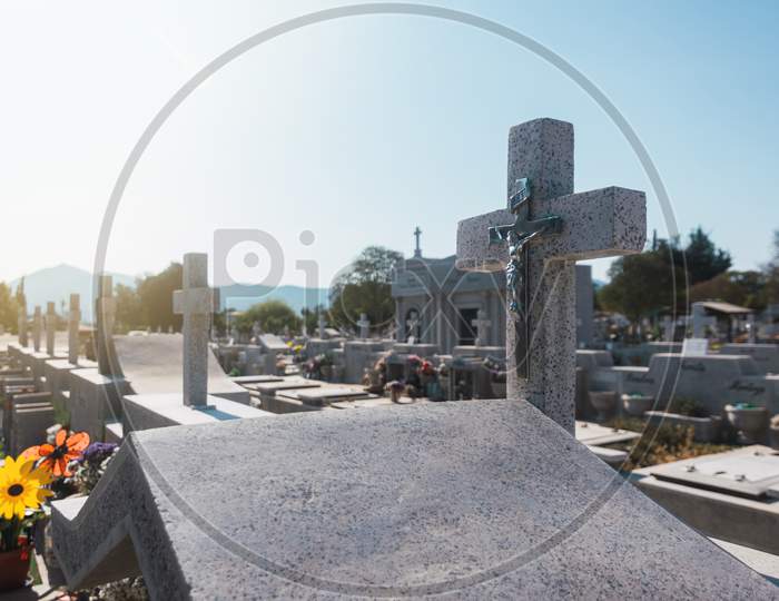 Marble Cross In Cemetery