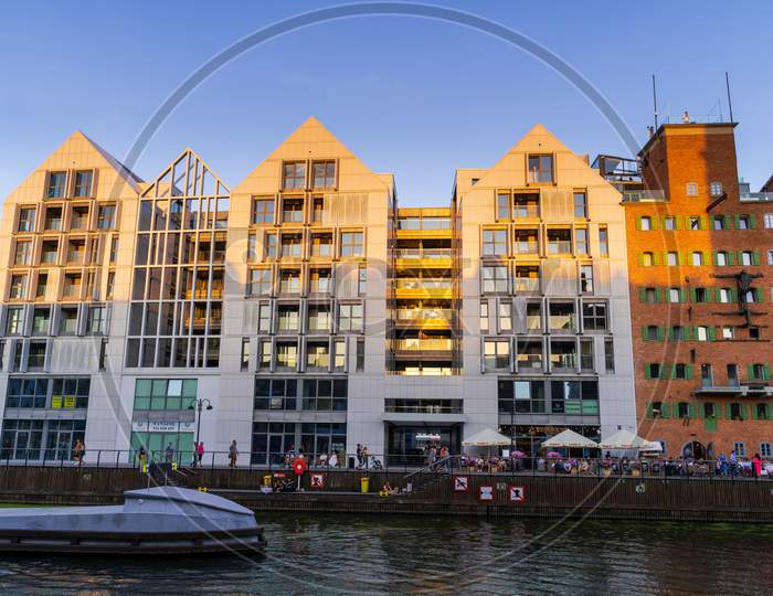 Gdansk, North Poland - August 15, 2020: Polish Architecture With Modern Building Apartment Located In The Commercial Market Over Motlawa River