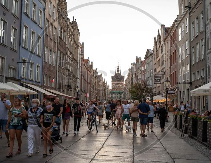 Gdansk, North Poland - August 13, 2020: Tourist Visiting And Taking A Walk At Main City Center Near Neptune'S Fountain During Corona Pandemic