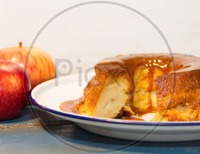 Bread Pudding Made With Stale Bread, Milk, Eggs And Sugar, Decorated With Liquid Caramel And Dulce De Leche