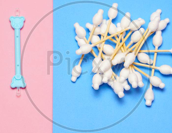 Bamboo Cotton Swabs Next To An Ear Wax Remover In A Colorful Background. Zero Waste Plastic Free Concept. Flat Lay