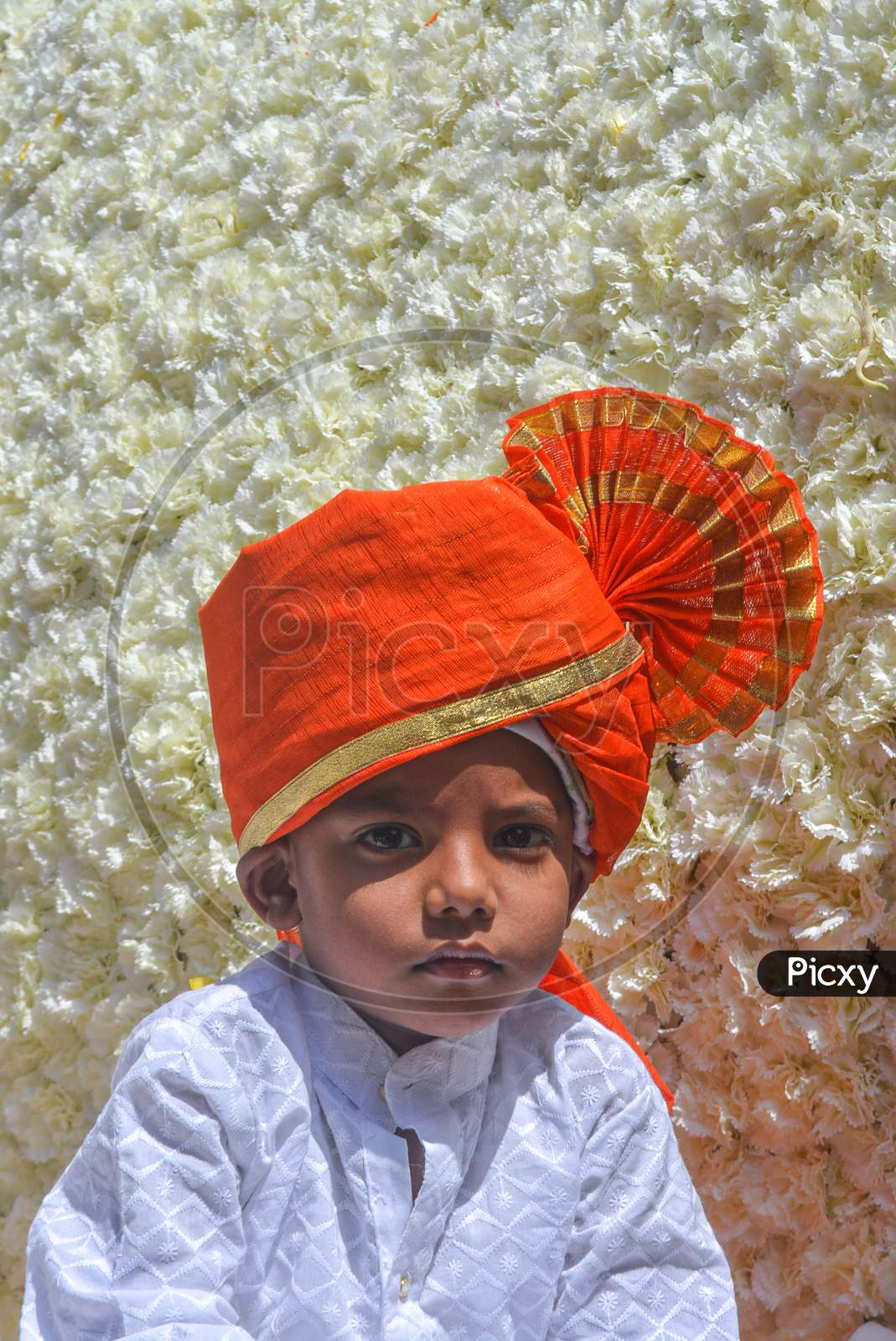 Pune, India - September 4, 2017: Vertical Portrait Of A Small Kid Wearing White Kurta And Orange Pheta On The Occasion Of Ganpati Visarjan Festival. Maharashtrian/Marathi Kid In Traditional Clothes.