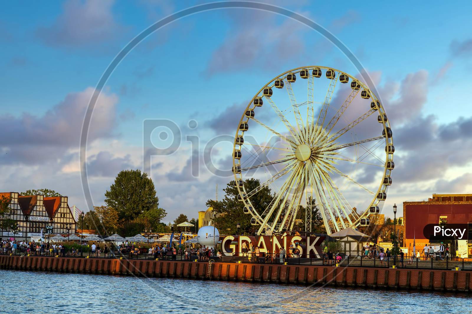Gdansk, North Poland - August 13, 2020: Ferries Wheel Against Dramatic Cloud In The City Center Main Square Over Motlawa River