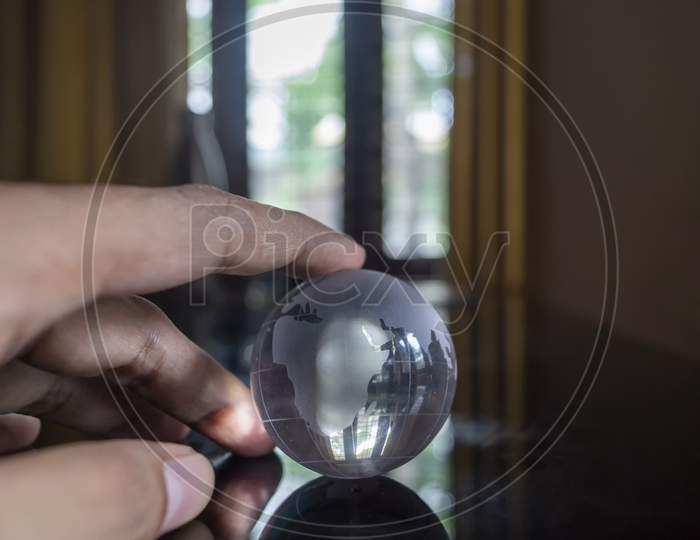 Transparent Globe In The Hand