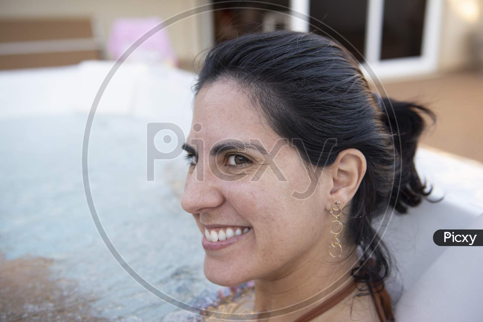 Beautiful Woman Smiling Wearing Bikini In A Hydromassage Bath.