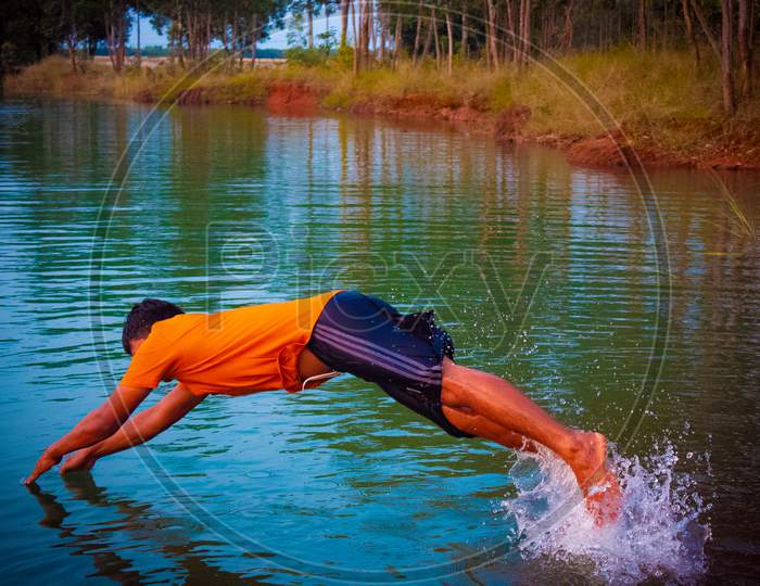 man diving to a water