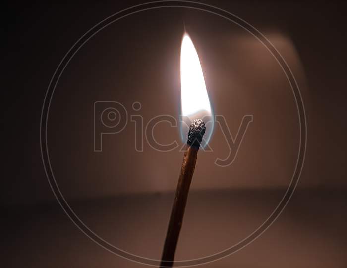 Burning matchstick with great details and texture of it.