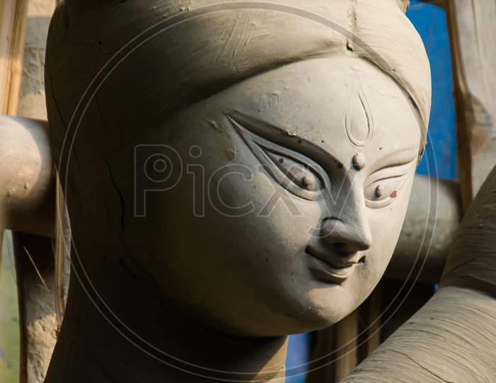 Close up of unfinished clay idol of Goddess Durga