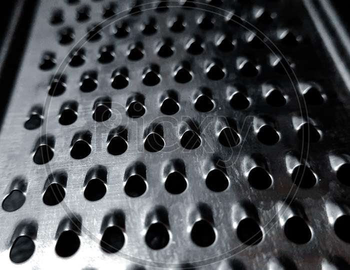 Chesse ginger grater macro photography.