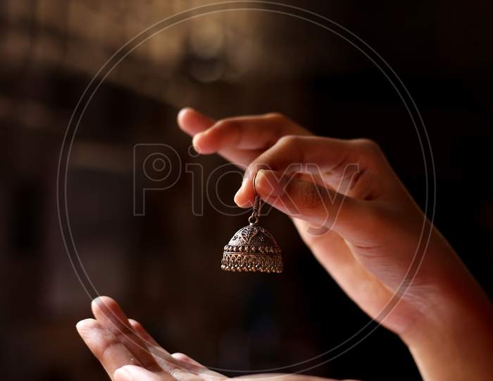 The Ethnic Jhumka Indian Traditional Ear Rings In Girls Hand