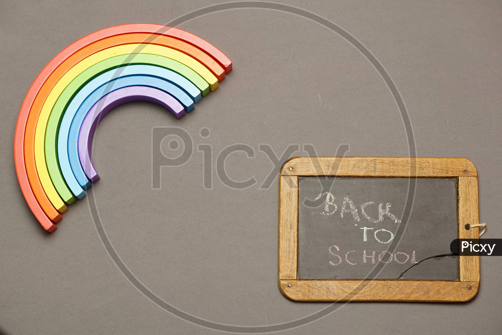 Top View Of Blackboard With Back To School Message And Rainbow. Covid 19. Flat Lay