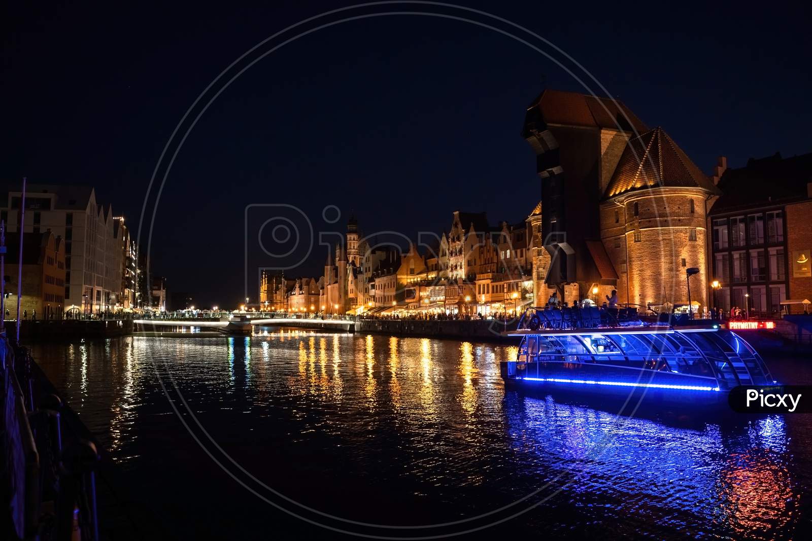 Gdansk, North Poland - August 15, 2020: Wide Angle Panoramic Night Photography Of Polish Cityscape With Polish Architecture In The Old Town Over Motlawa River Near Baltic Sea