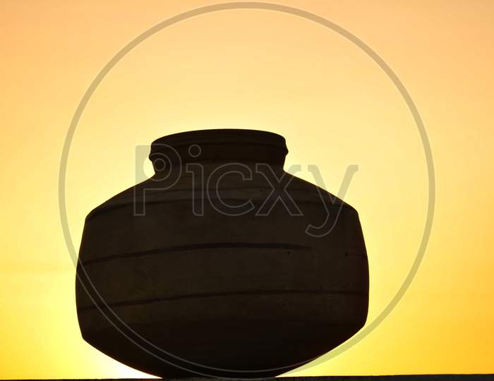 A close up shot of an earthen pot or a clay pot