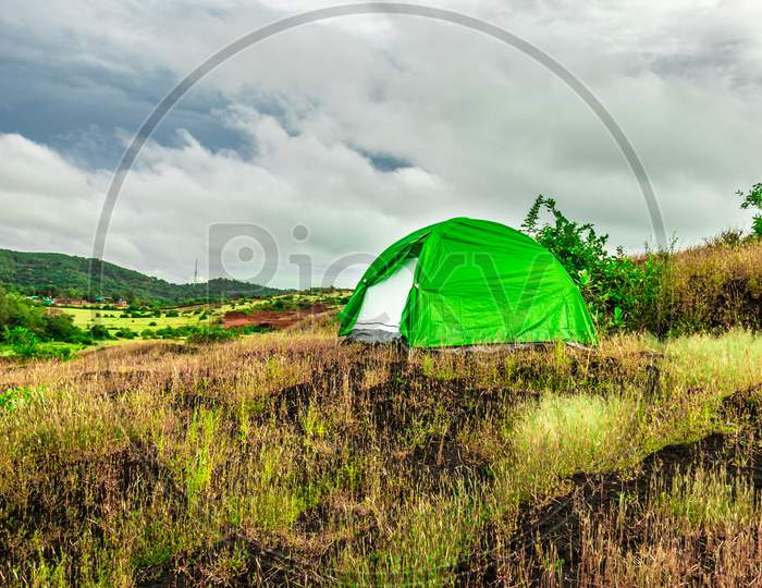 Camping Solo At Mountain Top With Dramatic Sky