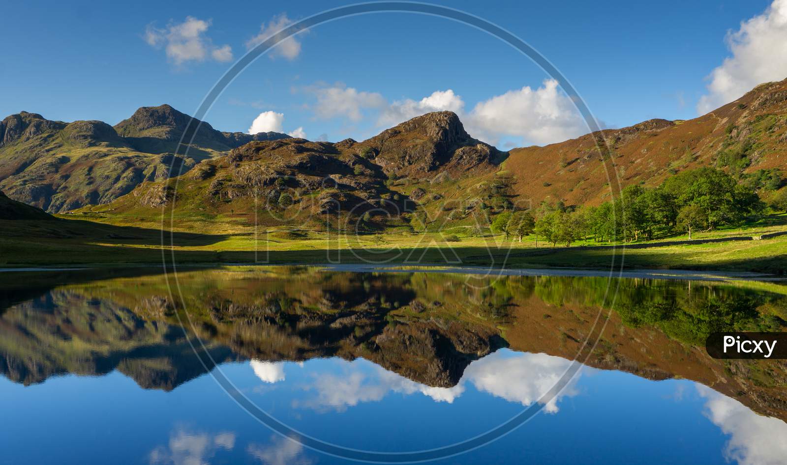 Reflections Of The Langdales In Blea Tarn In The English Lake District, Uk