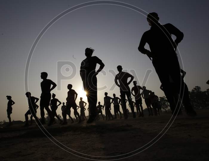 Youth perform physical exercises during practice session for upcoming Recruitment for border youth in security forces,near international border ranbir Singh pura outskirts in Jammu on September 11,2020.