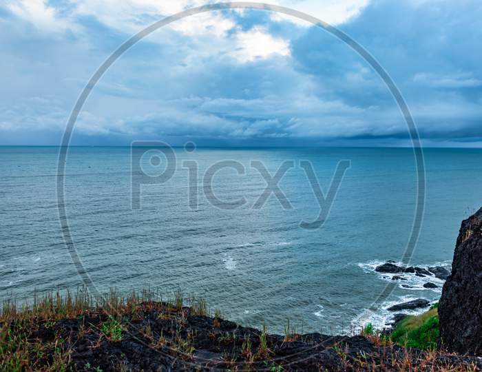 Sea Horizon View With Dramatic Cloud From Mountain Top