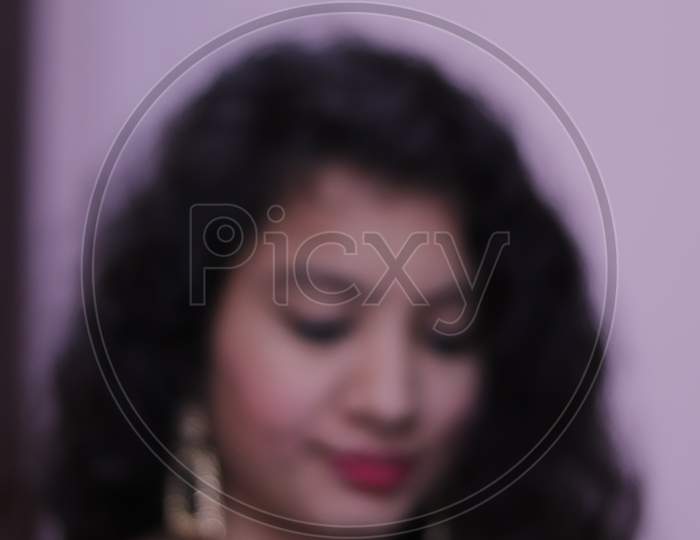 blurred portrait of beautiful indian young woman