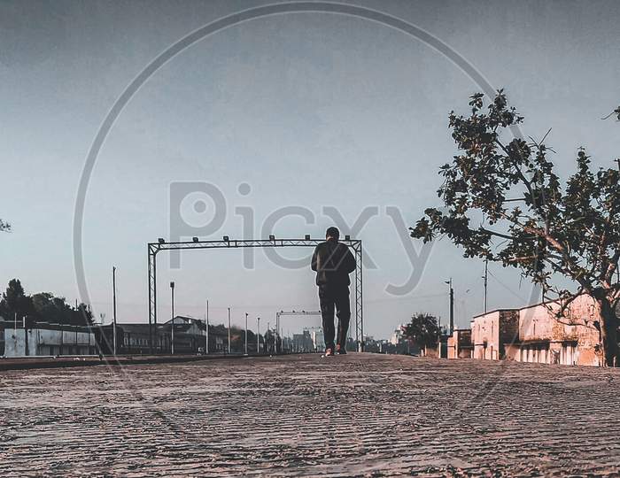 a man jogging at a platform in early morning