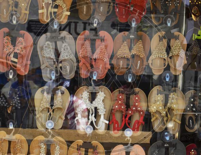 Display of Ladies Shoes  of Various Colour in a Shop