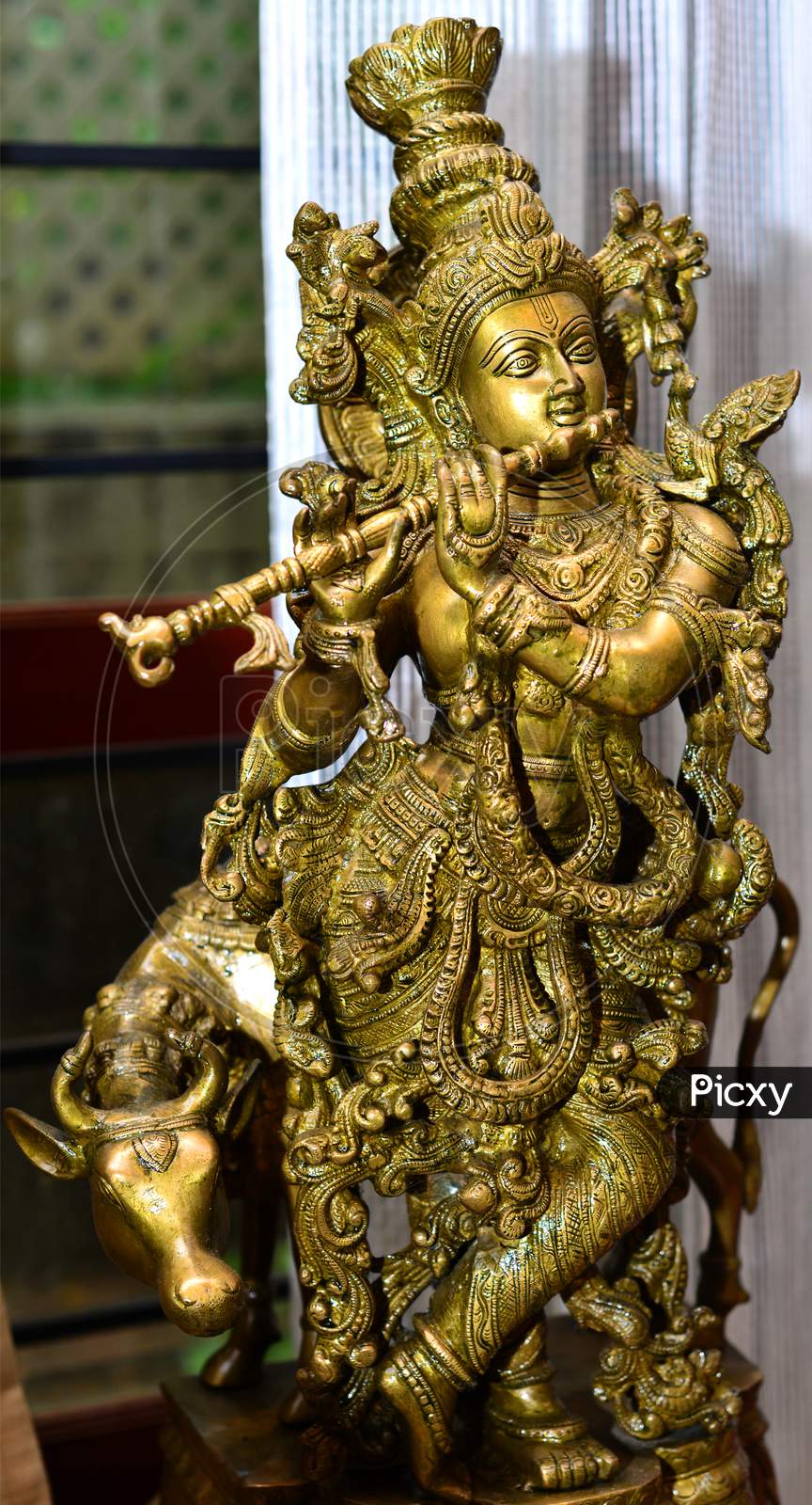 A Brass Statue Of Lord Krishna.