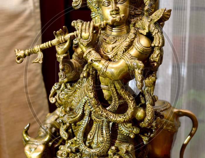 A Brass Statue Of Lord Krishna.