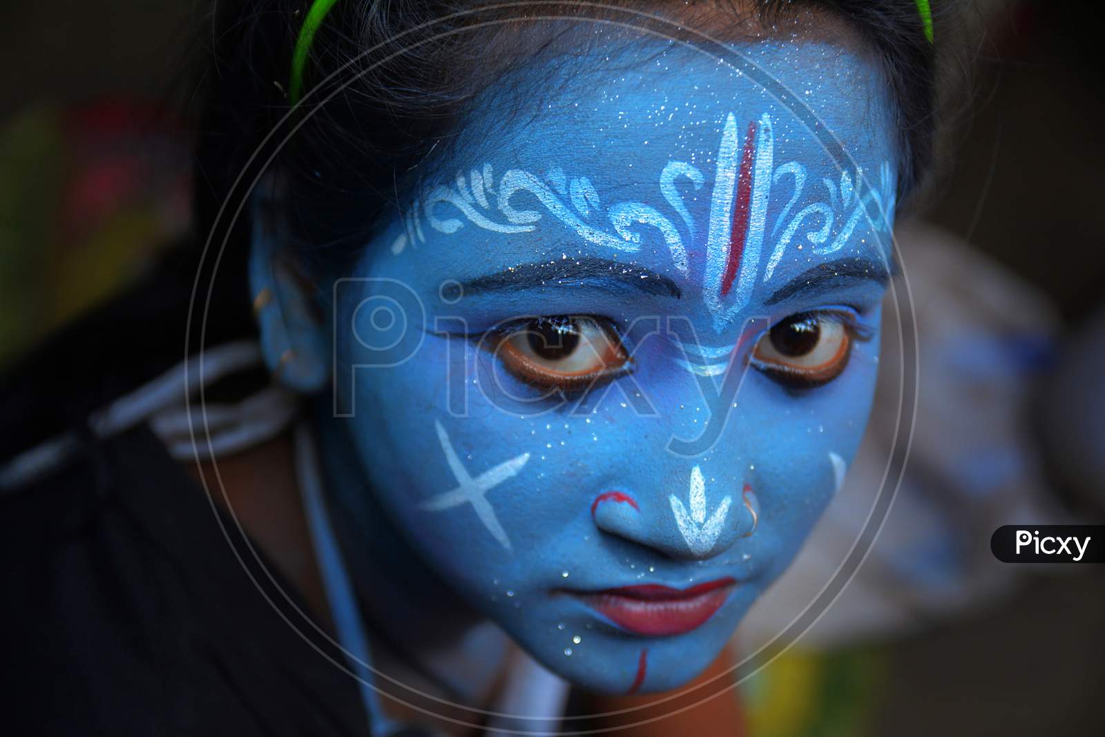 A Girl Painted Her Face Like Shri Krishna in Gajon Festival