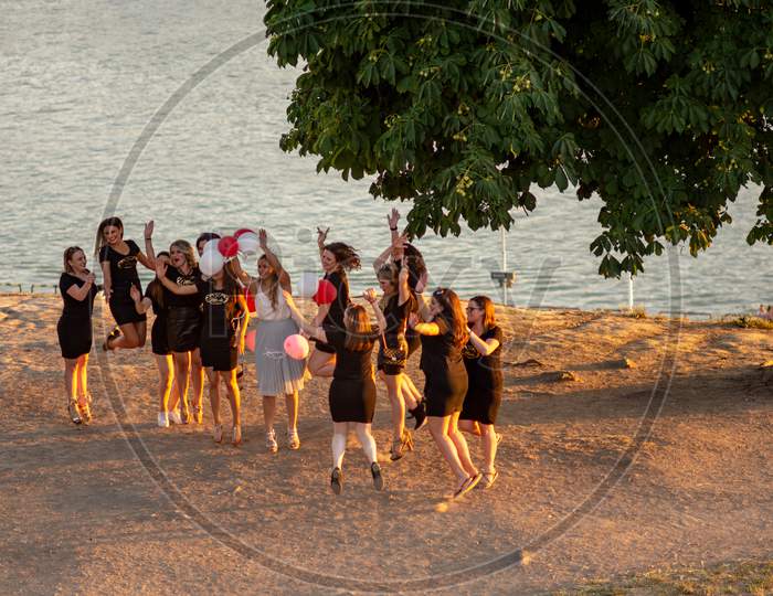 Happy Bridesmaids Jumping And Posing For A Photo At Belgrade Fortress, Serbia