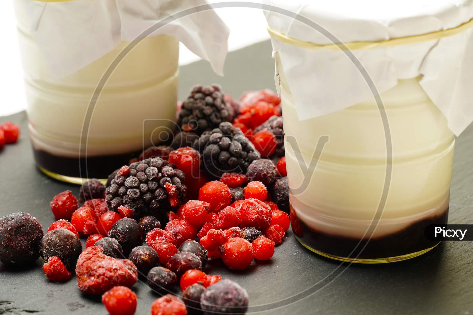 Organic Yogurts Of Blackberries And Red Fruits. Gastronomic Photography