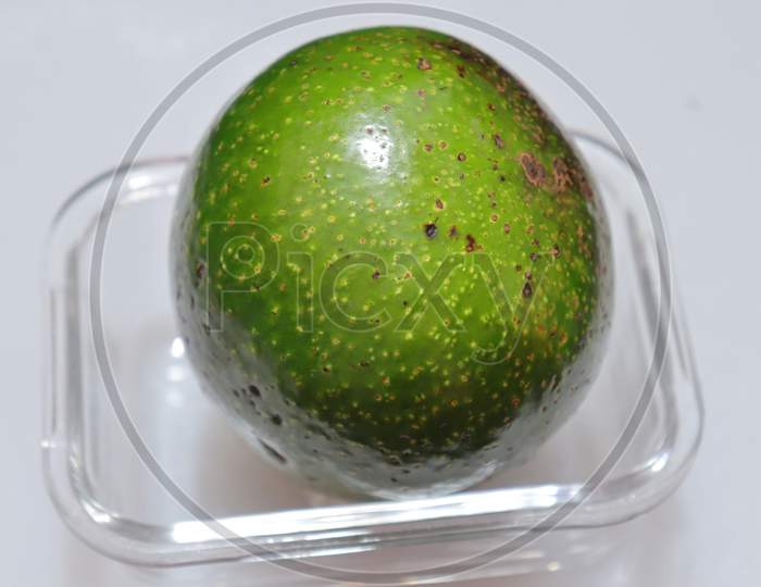 fresh avocado isolated on white background closeup