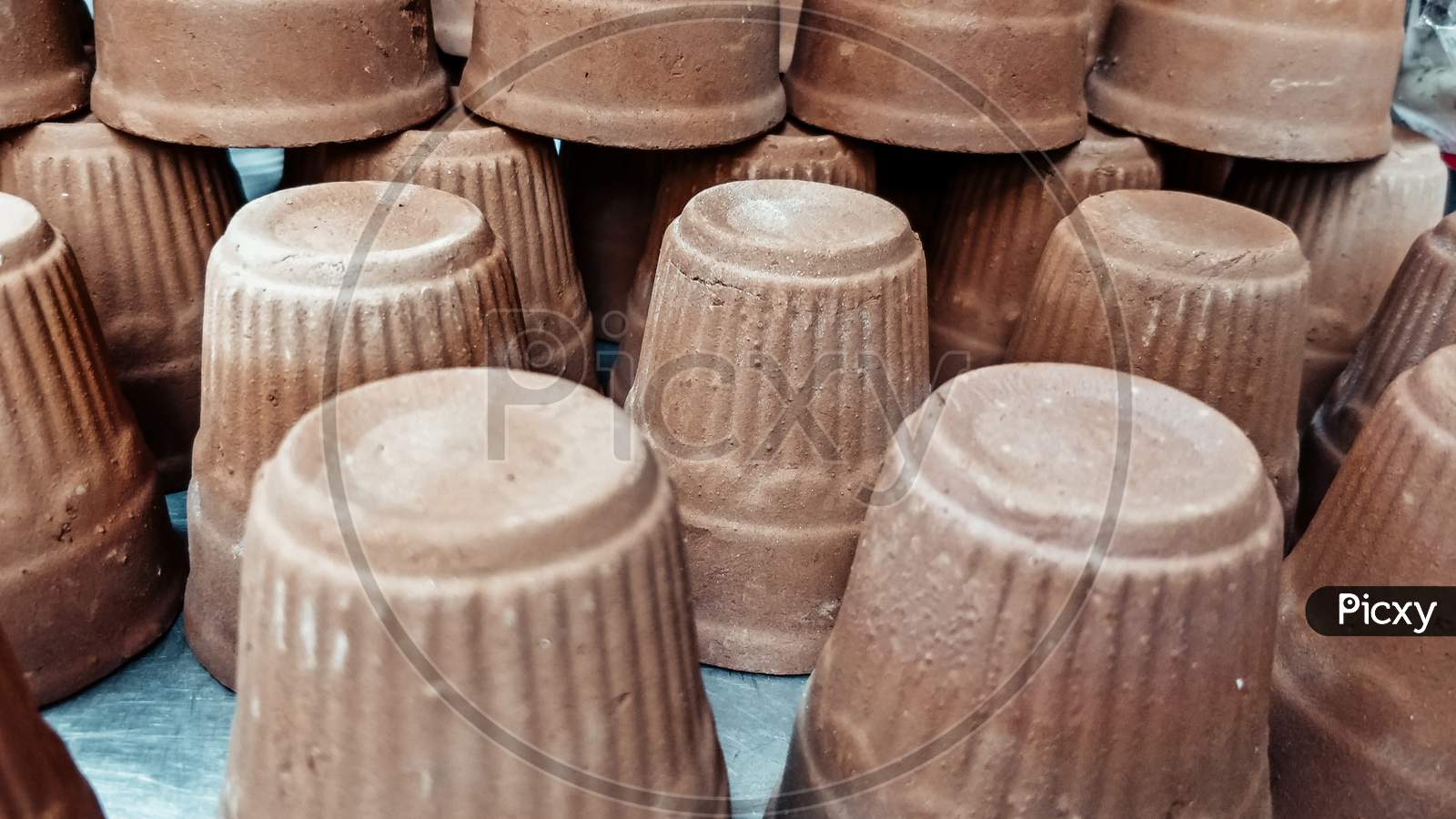 Image Of Cups Made Of Mud Or Sand Called Kulhad/Kullhad Used To Serve Authentic Indian Drinks Called Lassie/Lassi, Milk, Tea.