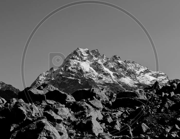 A postcard image of a majestic peak with clear sky