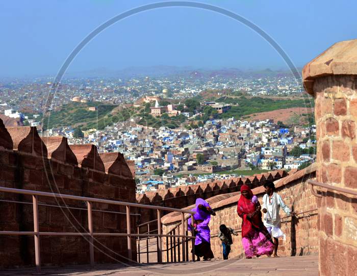 Some people in Mehrangarh Fort,Rajasthan with Jodh Pur City in the Back Ground