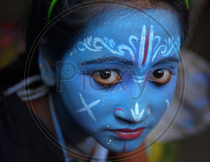 A Girl Painted Her Face Like Shri Krishna in Gajon Festival