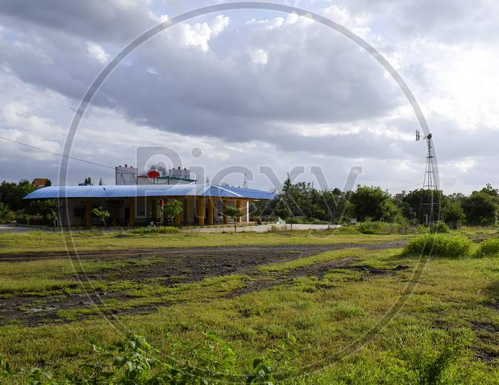 Long View Of City Bus Stand Building Isolated In Nature