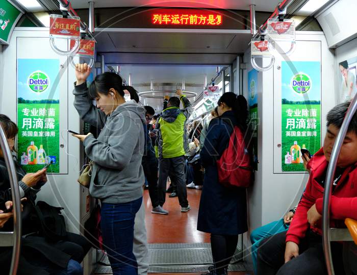People Taking A Ride On Beijing Subway