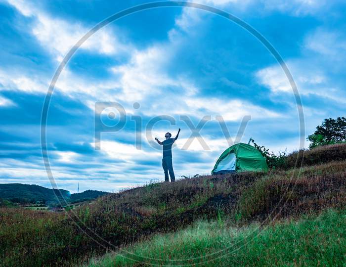 Camping Solo At Mountain Top With Amazing View And Dramatic Sky At Evening
