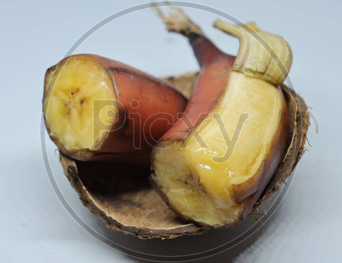 Bunch of fresh ripe red bananas on white background