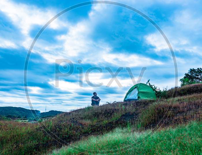 Camping Solo At Mountain Top With Amazing View And Dramatic Sky At Evening