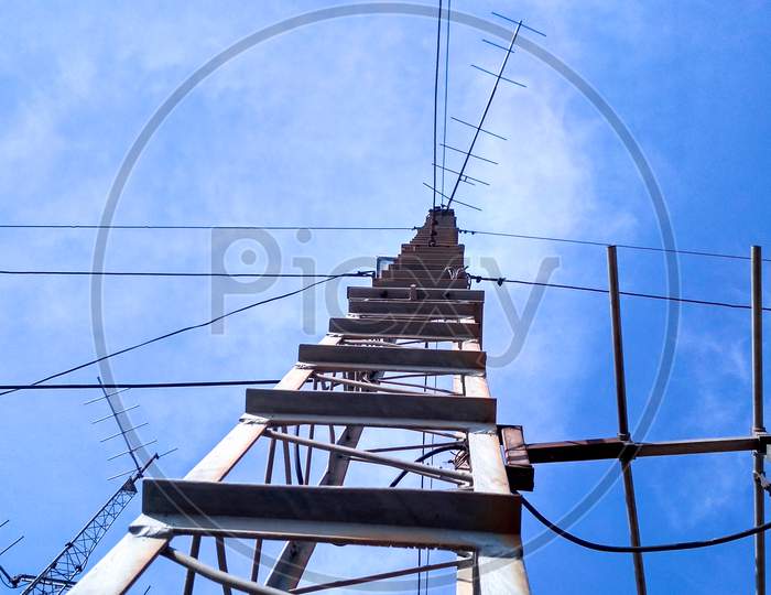 Low Angle Shot Of A Metal Construction Under A Blue Sky