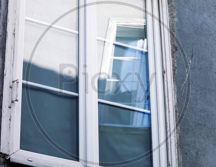 Gdansk, North Poland: An Artistic Close Up Shot Of Window Reflection Within A Closed Window With White Background In The City Center Main Square