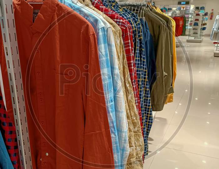 A Trendy collection of traditional Indian Kurtas for Men in different colors and designs displayed at a Fashion store in Mysuru of Karnataka state in India.