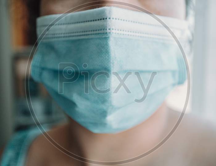 Super Close Up Of A Woman Wearing A Surgical Mask During A Bright Day