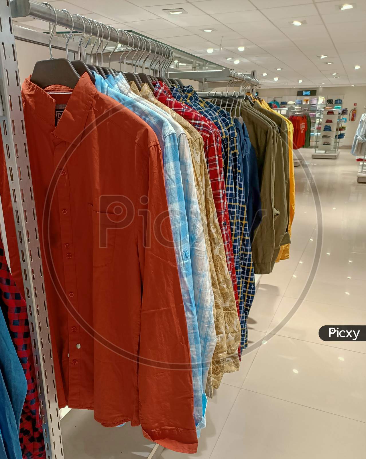 A Trendy collection of traditional Indian Kurtas for Men in different colors and designs displayed at a Fashion store in Mysuru of Karnataka state in India.