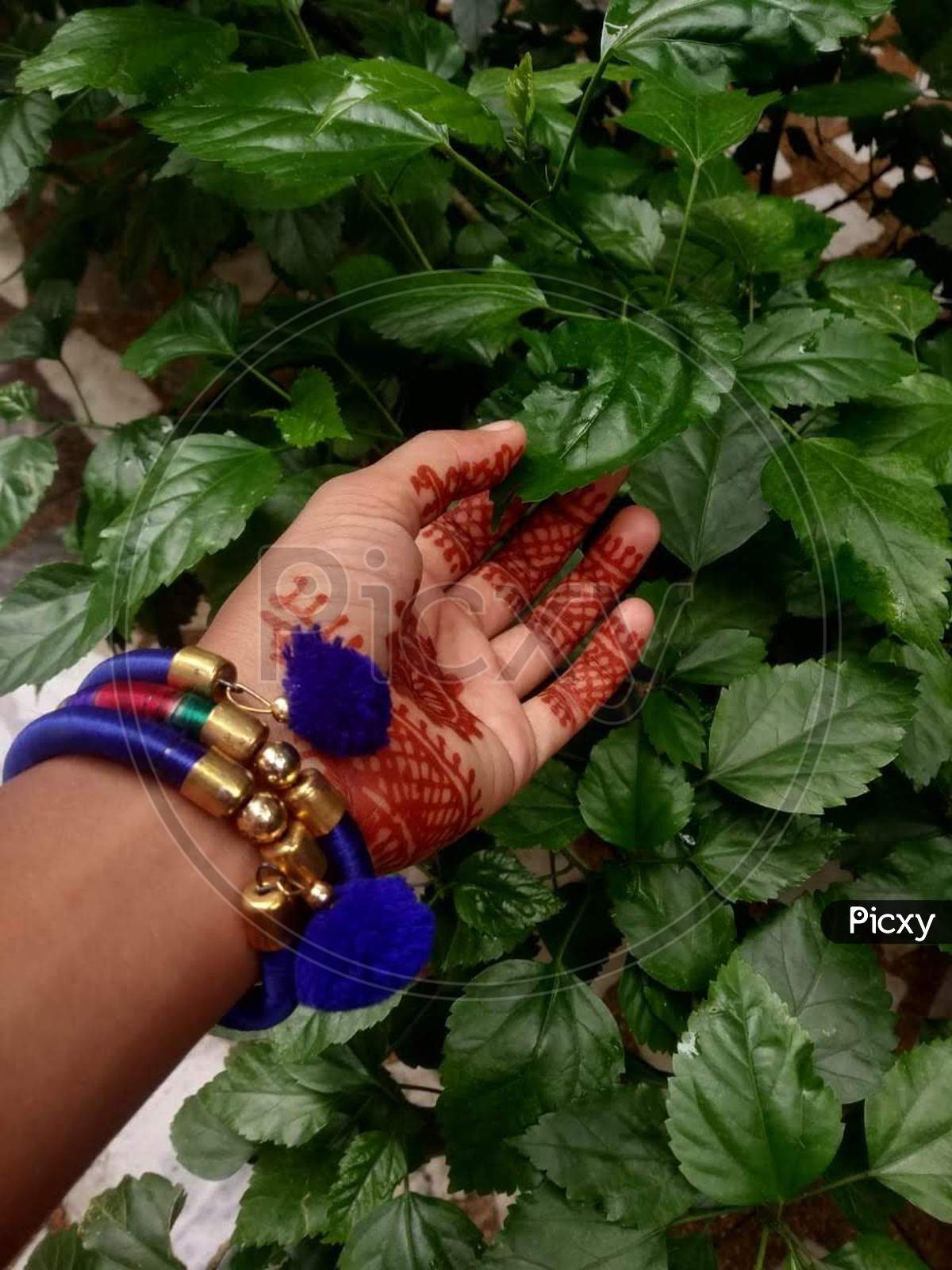 Mehndi and bracelet in leaves so pretty