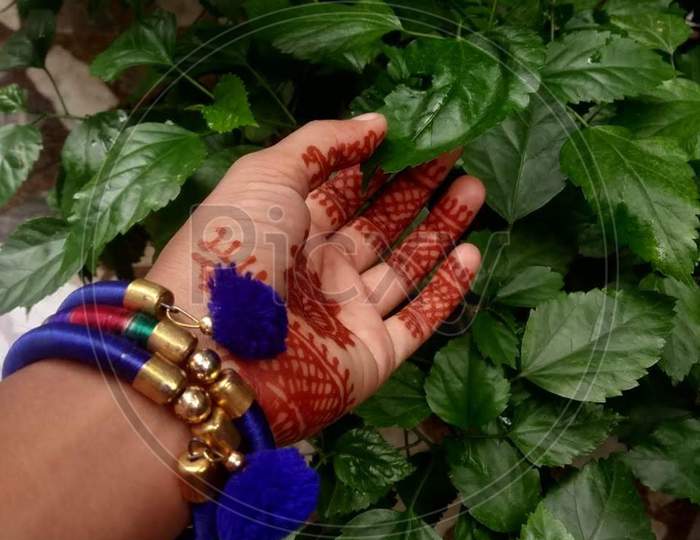 Mehndi and bracelet in leaves so pretty