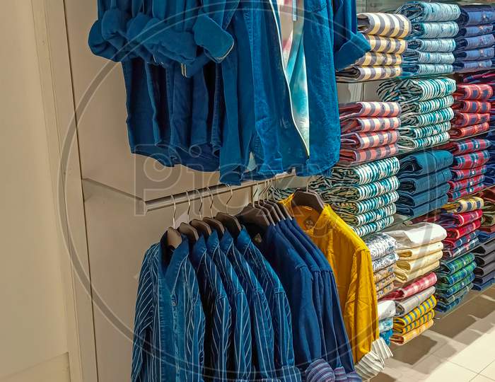 A Beautiful stacked Trendy Casual and Formal Shirts in various Colors and Designs at a Fashion store in Mysuru city of Karnataka state in India.
