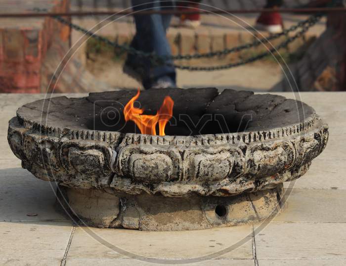 Eternal or Endless flame symbolized peace and harmony at Lumbini, Nepal .