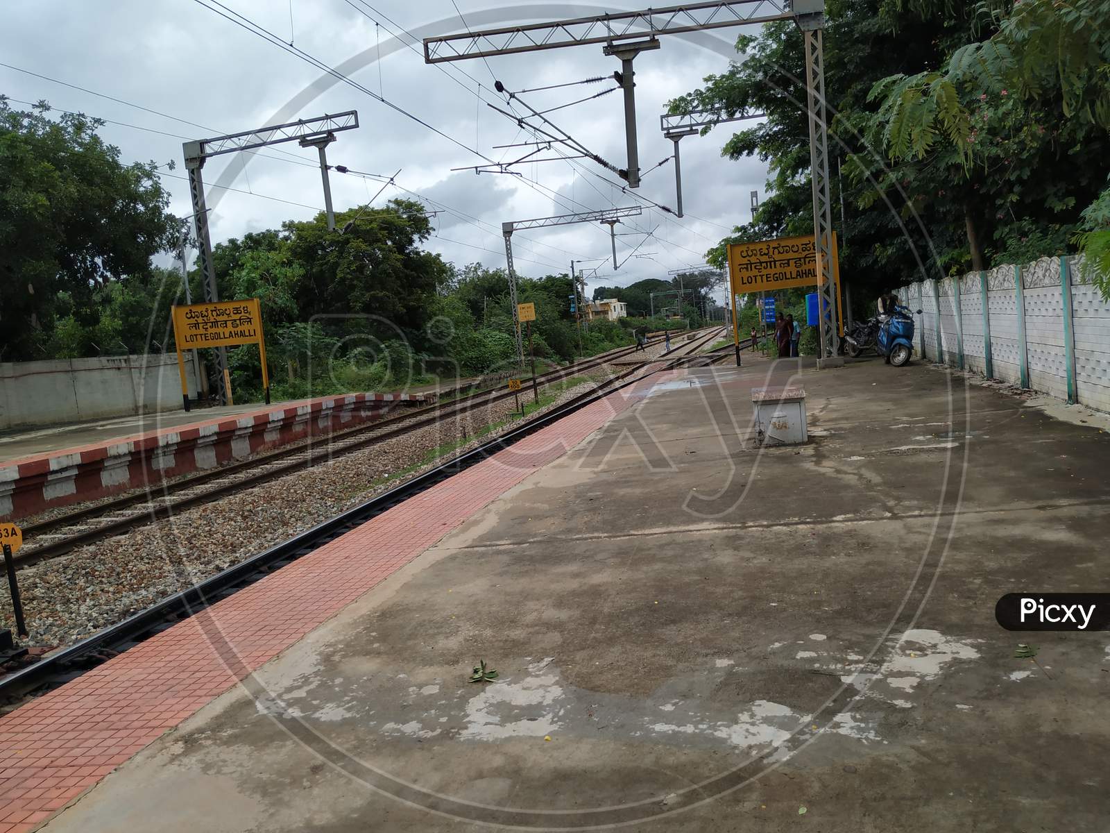 Closeup of Lottegollahalli Railway Station with Yellow and black Color Name Board