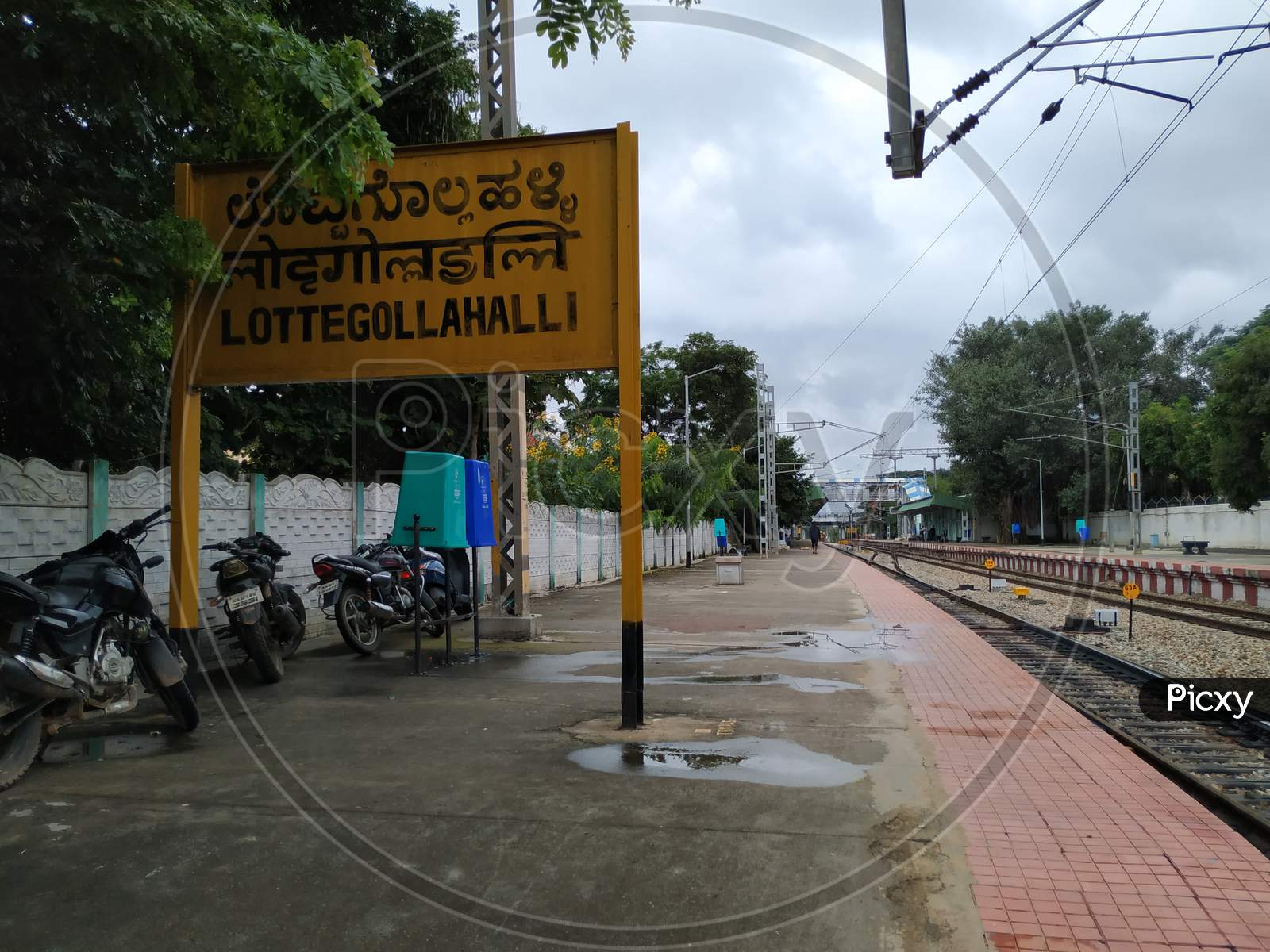 Closeup of Lottegollahalli Railway Station with Yellow and black Color Name Board